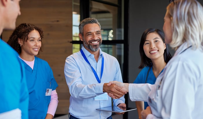 Group talking handshake with care providers