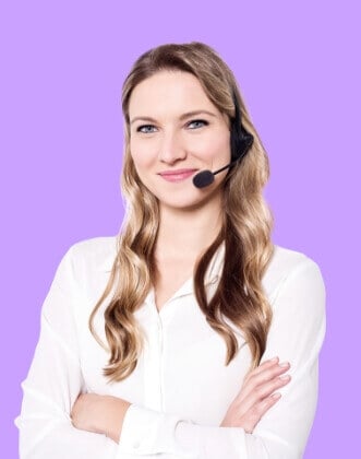 a woman smiling and wearing a headset