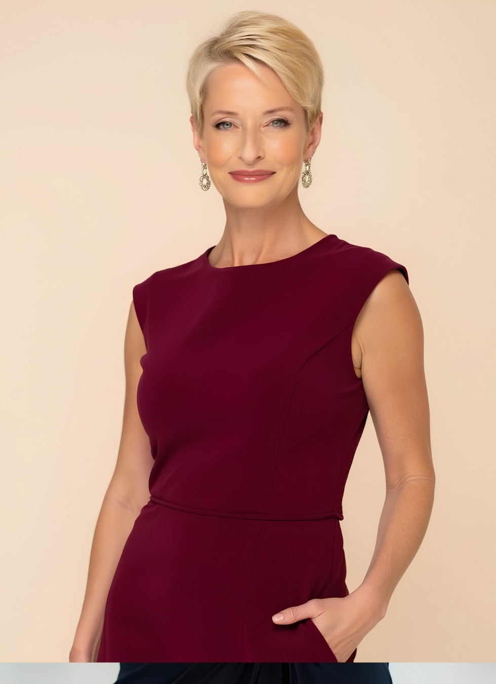 Kirsten Baker headshot maroon dress