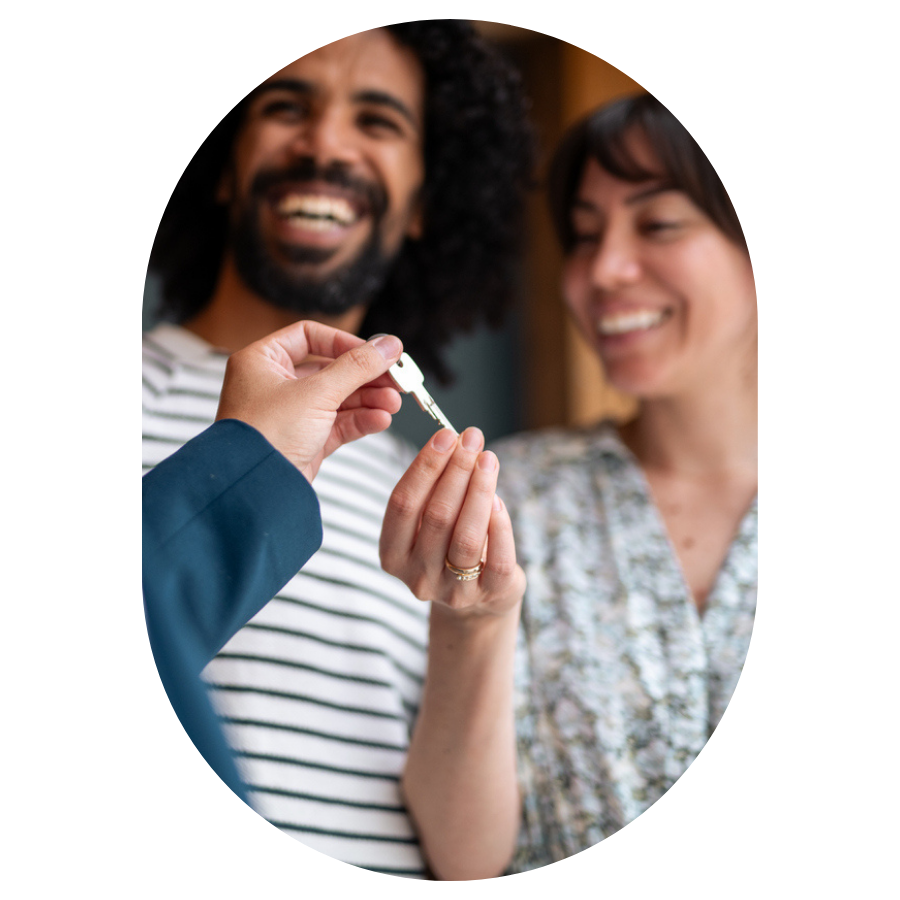 Peruvian couple getting the key to new apartment
